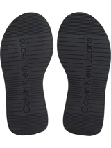 Sandalias tipo slide Calvin Klein de cuero negro con doble tira y plataforma.