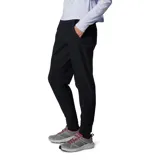 Pantalón jogger negro de mujer, marca Columbia, modelo Leslie Falls. Confeccionado con tejido Omni-Shield™ que repele la humedad y Omni-Shade™ UPF 50 que protege de los rayos UVA/UVB. Cuenta con cintura elástica, bolsillos laterales y traseros, y un bolsillo de seguridad con cremallera.