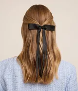 Set de dos pinzas para el pelo con moña de poliéster.