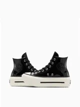 Zapatillas Converse Chuck Taylor All Star Lift de caña alta, color negro charol, con plataforma blanca y cordones negros.