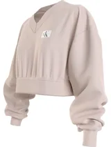 Buzo Calvin Klein Jeans color beige, de corte cropped, con cuello en V y logo bordado en el pecho.