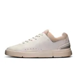 Championes urbanos de cuero sintético color blanco, con detalles en beige y celeste. Diseño minimalista con perforaciones laterales y logo de la marca en el lateral exterior.