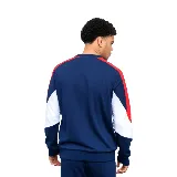 Buzo deportivo azul marino con detalles en blanco y rojo en mangas y hombros. Presenta el logo de Umbro bordado en el pecho y el escudo del Club Nacional de Football.