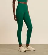 Calza legging deportiva color verde agua, de microfibra, con cintura ancha y bolsillos laterales.