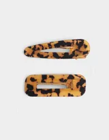 Set de dos hebillas para el pelo de acrílico con estampado carey, en diferentes formas geométricas.