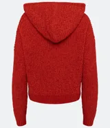 Buzo de tejido chenille texturizado en color rojo, con capucha ajustable mediante cordones y puños y ruedo acanalados.