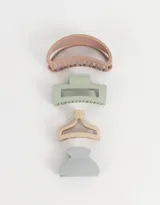 Set de cuatro broches para el pelo de diferentes formas y tamaños, en colores pastel: rosa, verde, beige y celeste.
