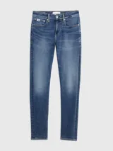Jeans de denim elástico azul con efecto lavado, corte skinny, tiro bajo, cinco bolsillos y cierre con cremallera.