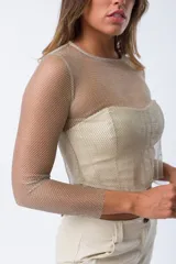 Buzo de red color plata con top tipo corset incorporado.
