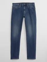 Pantalón de jean azul oscuro, de corte slim y tiro medio.