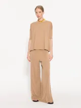 Pantalón palazzo negro de tela de punto con cintura elastizada.