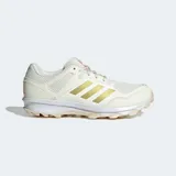 Championes de hockey Adidas Fabela Rise color crema con detalles dorados y suela blanca.