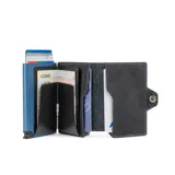 Billetera negra de cuero con caja de aluminio incorporada con sistema de deslizamiento para tarjetas, protección RFID, espacio para 5 tarjetas, sección para hasta 7 billetes y espacio adicional para libreta de propiedad y de conducir.