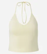 Blusa cropped de frente única color crema, confeccionada en algodón con elastano, con escote en V y lazo en el cuello.