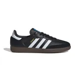 Championes Adidas Samba Og unisex, color negro con las tres tiras blancas y suela marrón.
