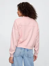 Buzo deportivo celeste con logo de la marca Gap en color blanco con diseño floral.
