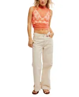 Top sin mangas de encaje color crema, con cuello alto y volados.