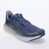 Championes de running New Balance Fresh Foam 1080 V12, color azul con detalles en amarillo y gris.