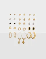 Set de 15 pares de aros dorados con strass, piedras y texturas. Incluye aros pasantes y argollas con dijes.