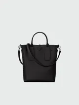 Bolso Longchamp modelo Le Roseau, color negro, tipo tote bag con doble asa corta y correa larga extraíble.