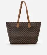Bolso shopper grande de cuero sintético color marrón con estampado de triángulos negros. Tiene doble asa de mano color marrón, cierre superior con cremallera y detalle de candado decorativo dorado.