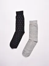 Pack de dos pares de medias de hombre, uno negro con pequeños lunares blancos y otro gris liso.