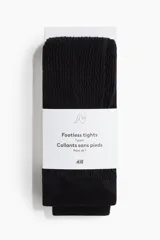 Calzas negras sin pie en punto trenzado suave con cintura estándar elástica y bajos acanalados.