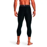 Calza deportiva Under Armour Heatgear Compression de hombre, color negro, corte capri y logo de la marca en la pierna izquierda.