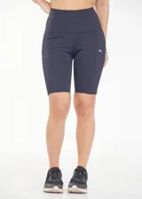 Calza biker deportiva de compresión color azul marino, con cintura alta, recortes y bolsillos laterales.