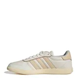 Championes Adidas Breaknet Sleek de mujer, color blanco hueso con las tres franjas laterales en beige claro. Presentan un diseño de corte bajo inspirado en el tenis, con suela de goma texturizada.