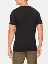 Remera negra de algodón con cuello redondo y mangas cortas. Estampado frontal con el logo "Calvin Klein Jeans" en color dorado.