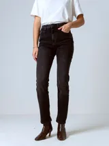 Pantalón de jean negro de corte skinny con tiro alto.