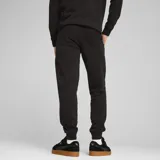 Pantalón de jogging Puma ESS N°1, color negro, con logo estampado en blanco en el muslo izquierdo.