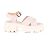 Sandalias color crema con plataforma track y tiras cruzadas.