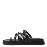 Sandalias bajas color blanco con tiras finas y tachas plateadas.