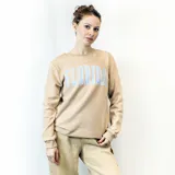 Sweater gris de corte clásico con cuello redondo y puños y cintura acanalados. Estampado frontal con la palabra "Florida" en letras celestes con borde blanco.