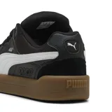 Championes Puma Park Lifestyle SK8, color negro con detalles en blanco y suela marrón.