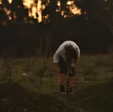 Polainas de cuero color camel, hechas a mano, diseñadas para proteger las piernas y tobillos.