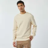 Sweater color crema de punto de piqué con cuello redondo y mangas largas.