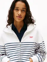 Buzo con capucha Tommy Jeans para mujer, con cierre frontal, diseño a rayas horizontales blancas y azul marino, y logo bordado en el pecho.