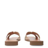 Sandalias Bottero tipo slide de cuero negro, con base plana color marrón y detalle metálico dorado en la tira superior.