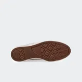 Championes de lona negros con diseño icónico, suela de goma de doble apilado y ojales mediales para transpiración.
