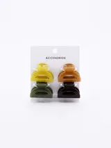 Set de cuatro mini broches para el pelo tipo pinza, en colores amarillo, verde, marrón y negro.