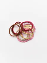Pack de 12 coleros elásticos de colores rosa, dorado, marrón y bronce con detalles de brillo.