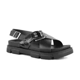 Sandalias negras de cuero sintético con plataforma track y hebilla metálica.