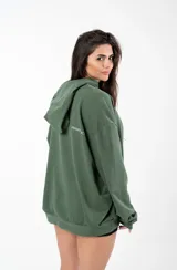 Canguro negro de algodón sin felpa, con capucha y bolsillo tipo canguro. Estampado con la palabra 'GAINS' en el pecho.