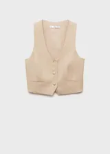 Chaleco color beige con cuello en pico, diseño crop, tirantes anchos y cierre de botón en la parte delantera. Tejido mezcla de lino y lyocell.