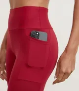 Pantalón legging deportivo color marrón, de cintura alta y con bolsillos laterales funcionales. Confeccionado en microfibra.