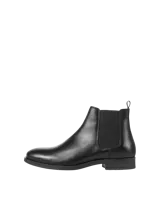 Botas Chelsea negras de cuero, con elásticos laterales y suela de goma.