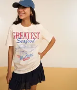 Minifalda azul marino de viscosa con cintura elástica y volado en el ruedo.